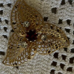 Elegant Gold Filigree Brooch with Red and Silver Accents